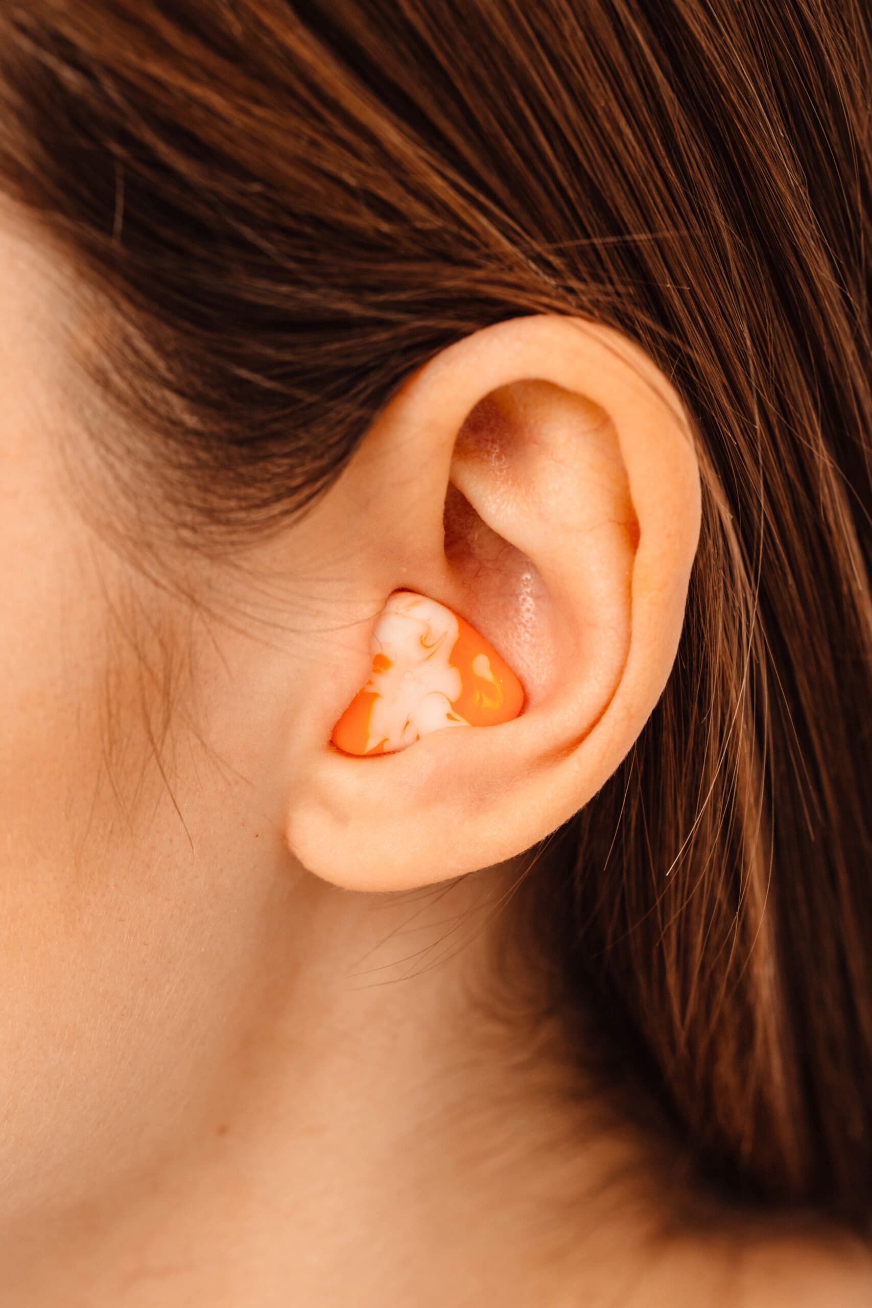 Womans ear with a hearing aid in it