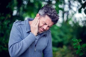 Man suffering from ear pain