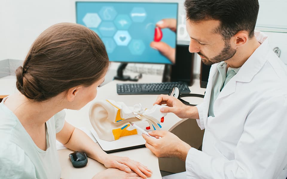 Audiologist and patient, hearing diagnostic, treatment, consultation in the hearing clinic