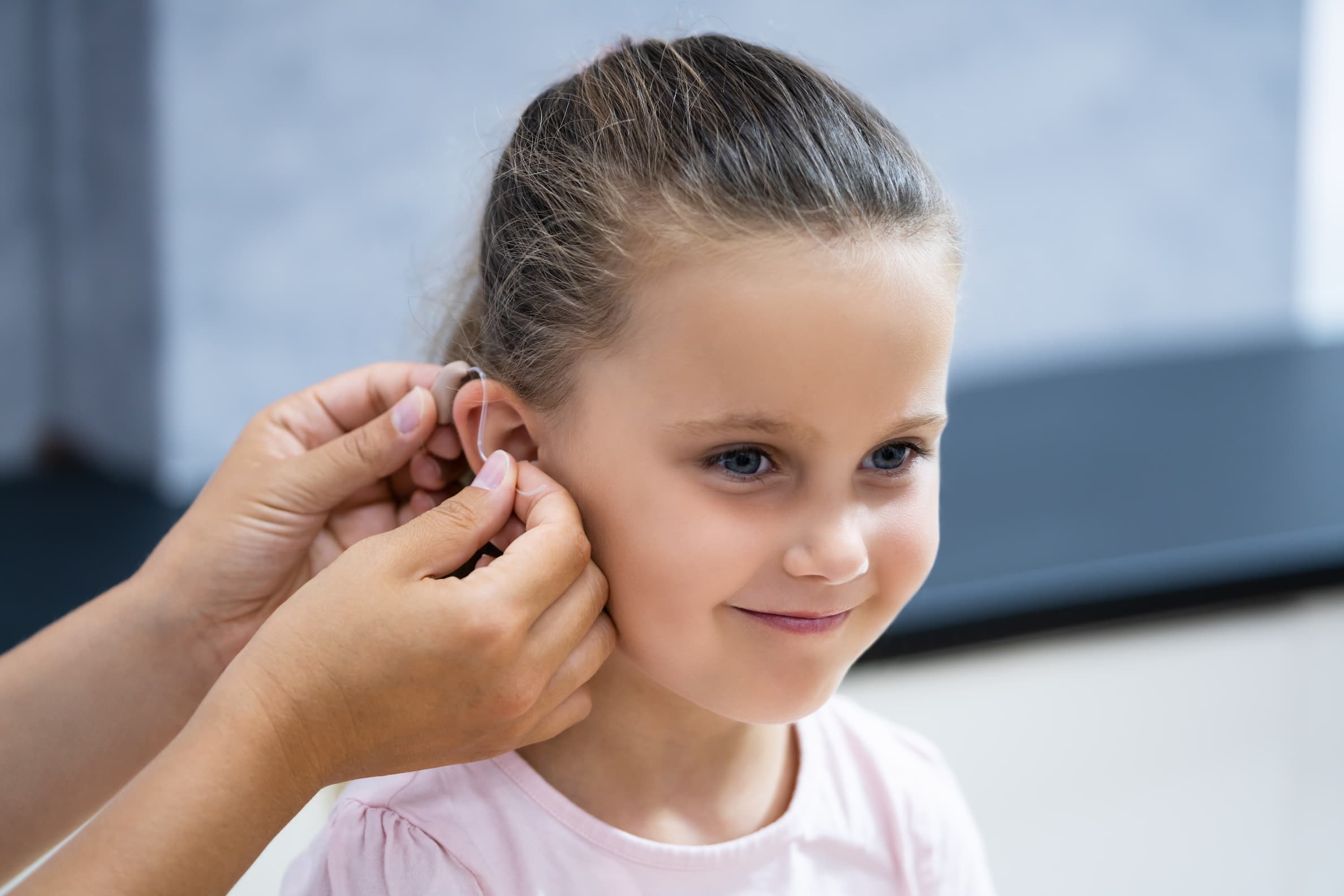 Young girl getting hearing tested.