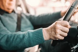 Senior man driving car