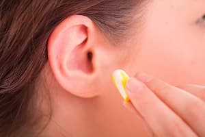 Woman with ear plug