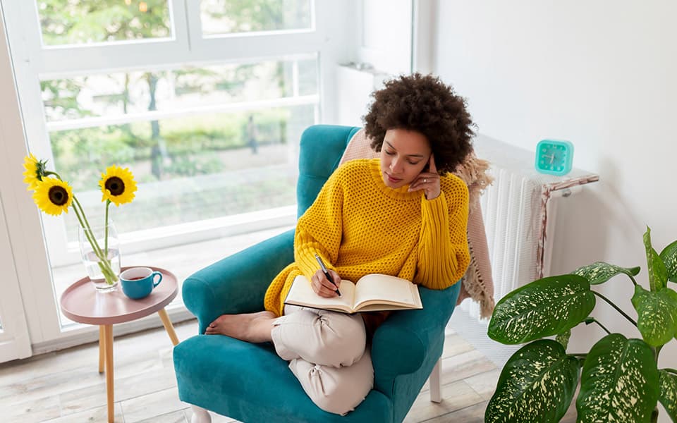 Woman writing in journal