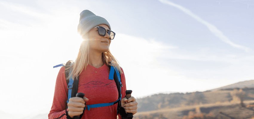 woman hiking with warm gear